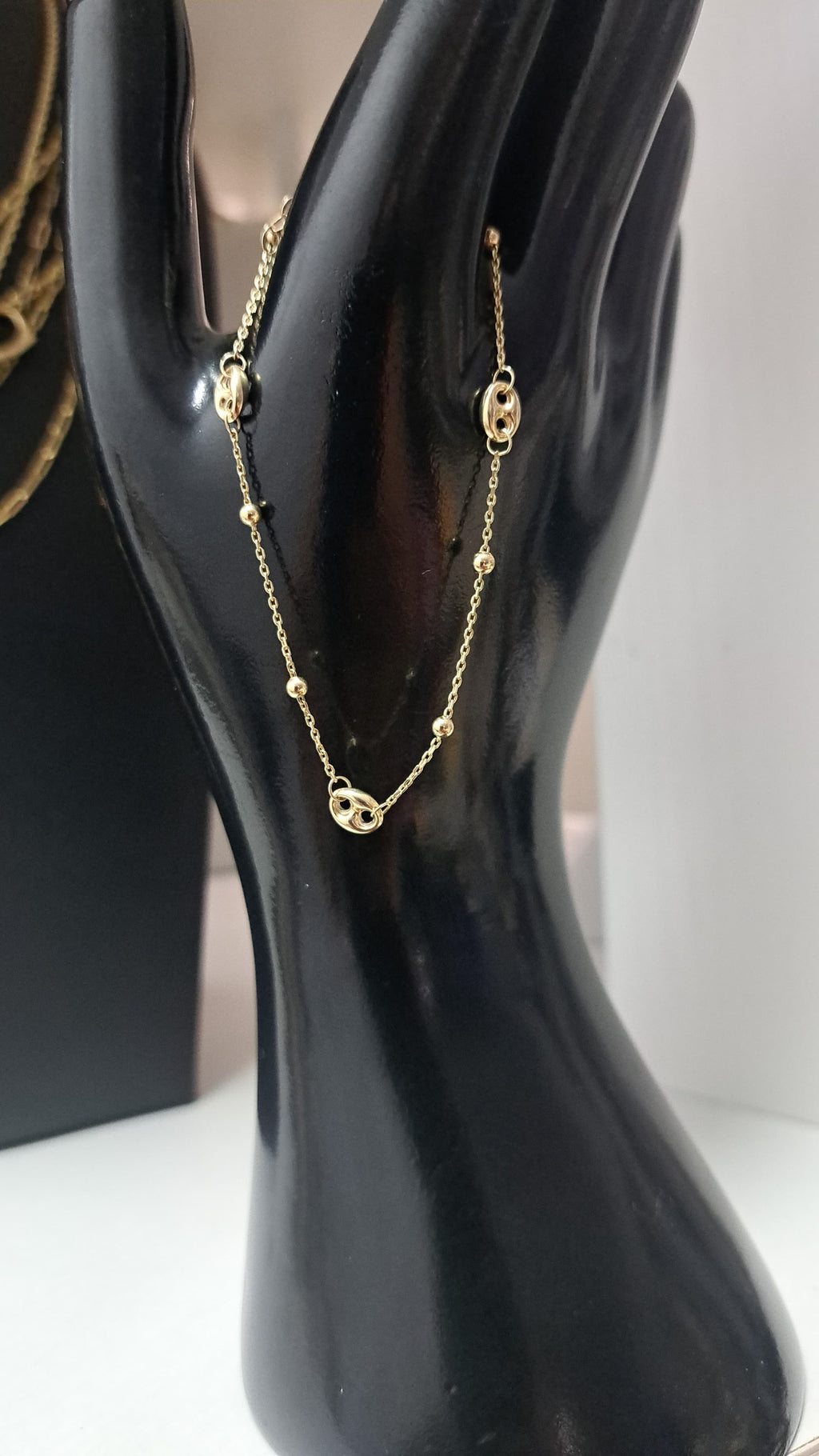 Manilla y aretes GG